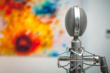 metallic interview mic with a flowered visual in the background