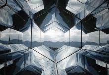 architectural reflective hexagons with a distant view of nature